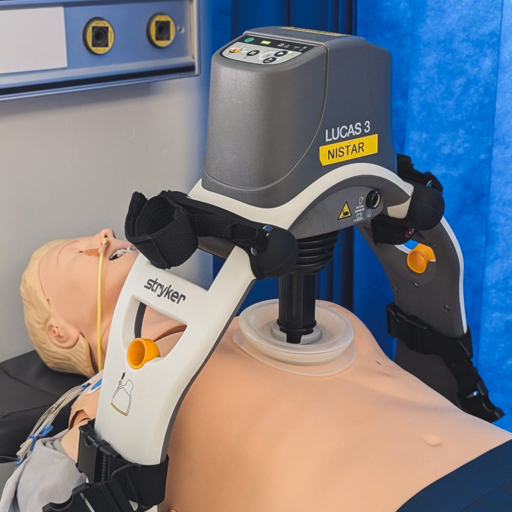 LUCAS defibrillator machine on mannequin around chest for demonstration purposes