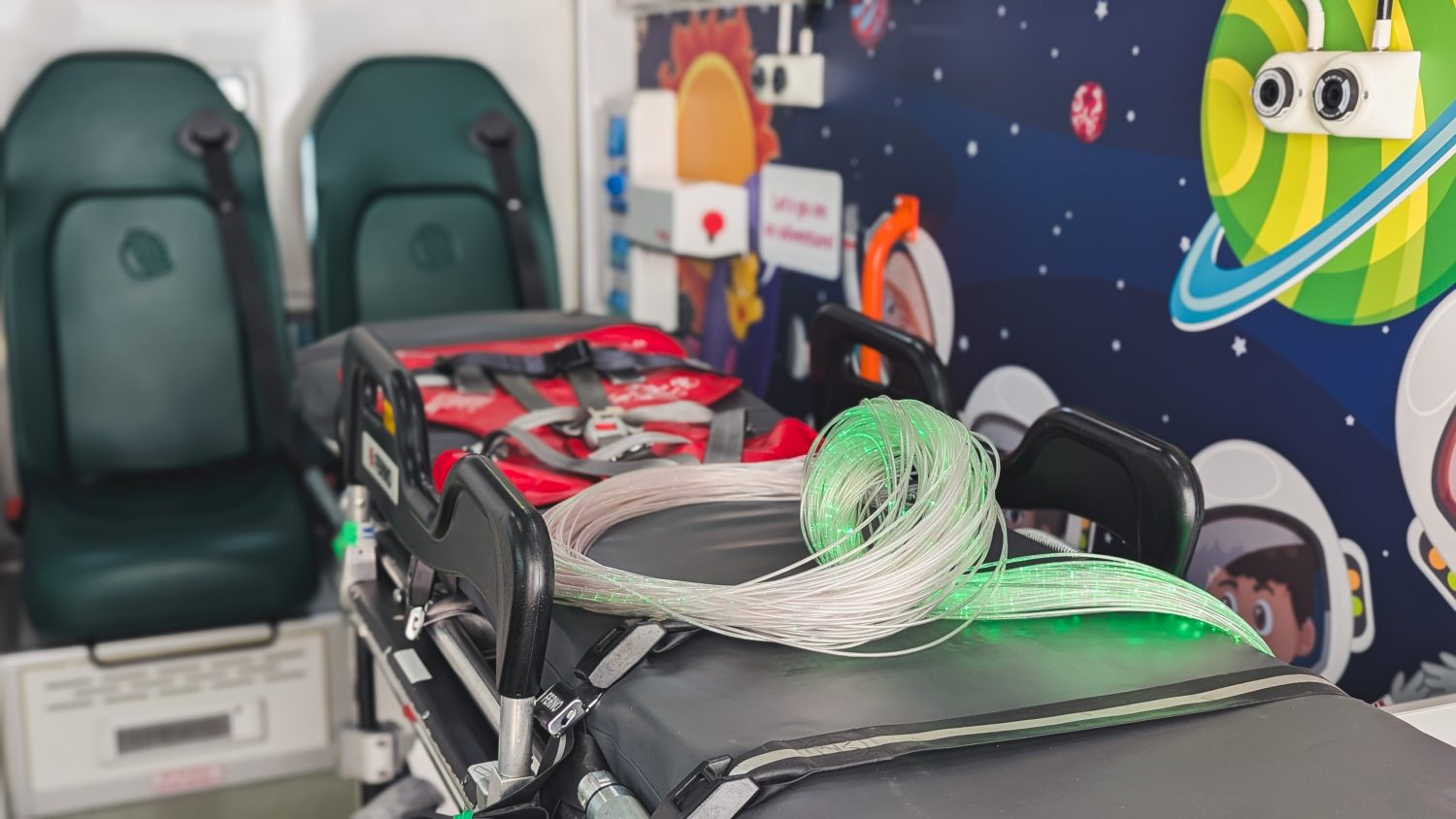 Nurse led trolley inside NISTAR vehicle with sensory fibre optic lights at end of trolley