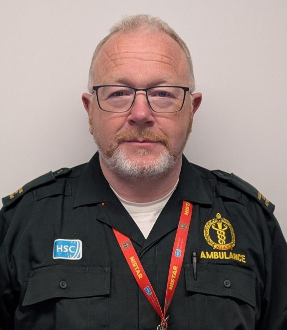 Photo of Peter McGurnaghan ACA standing against a white wall for profile