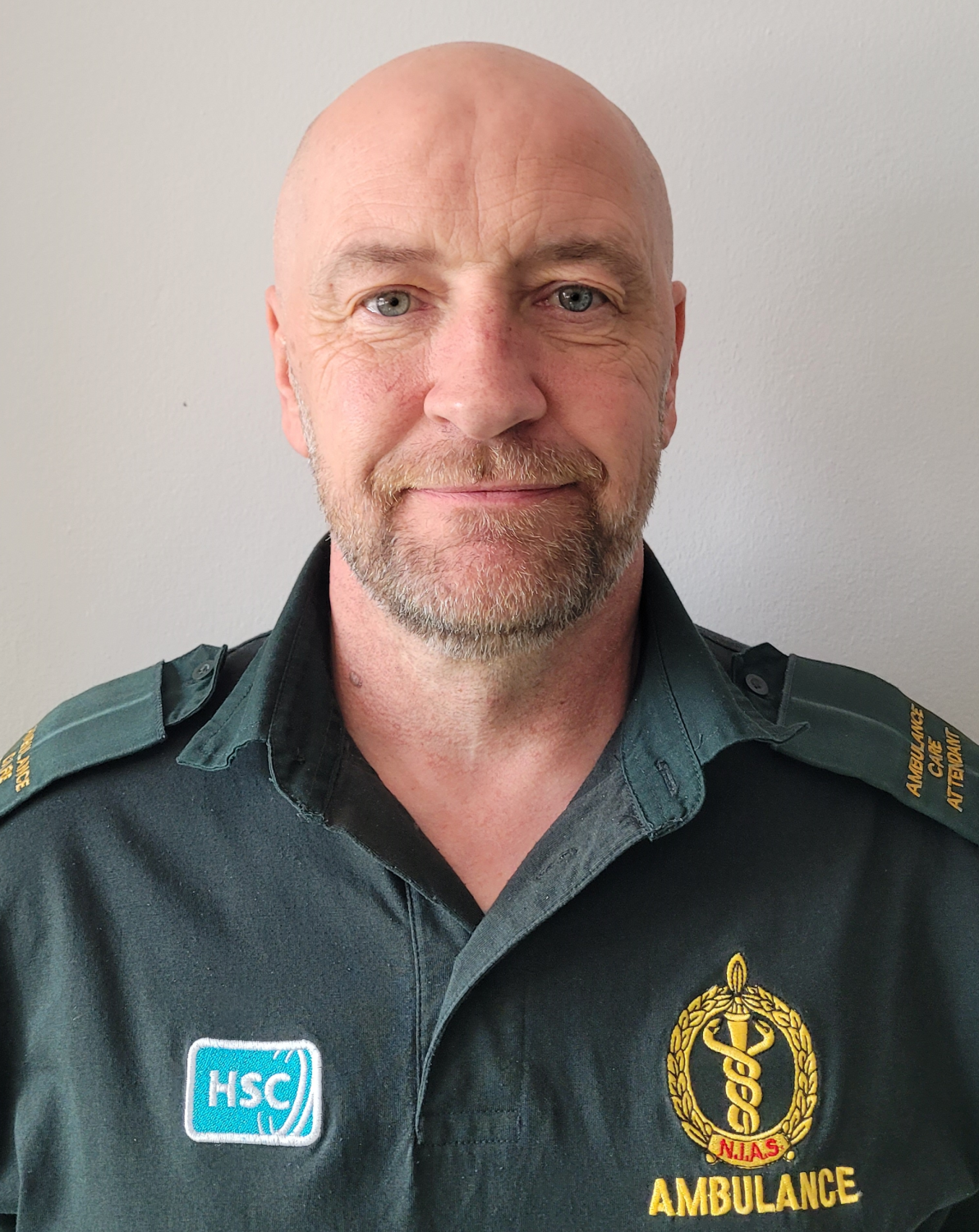 Photo of Philip Johnston ACA standing against a white wall for profile