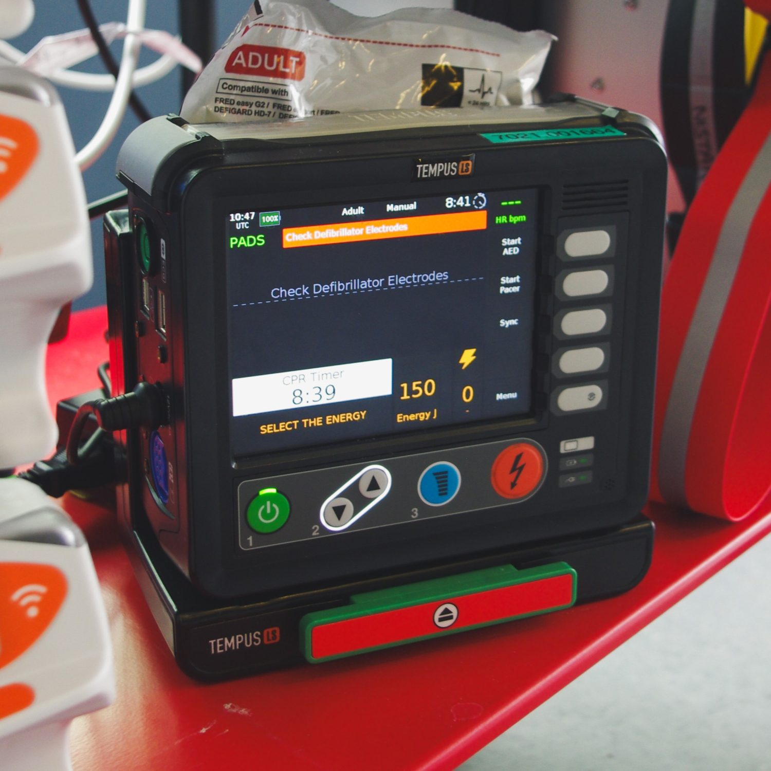 Tempus defibrillator on bottom of transport trolley
