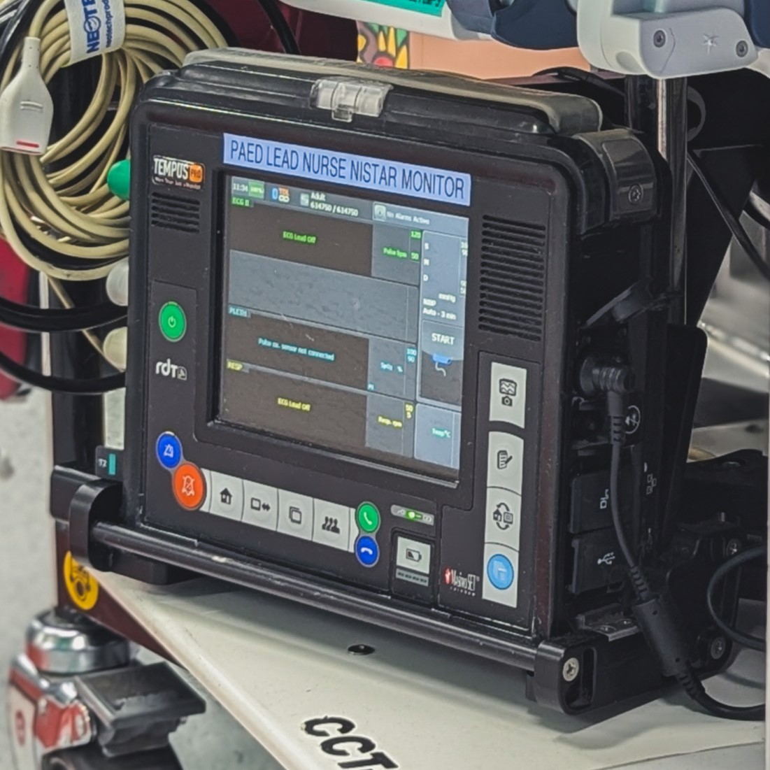 Tempus bservation monitor on bottom of paediatric transport trolley